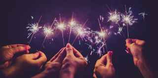 Image of hands holding sparklers